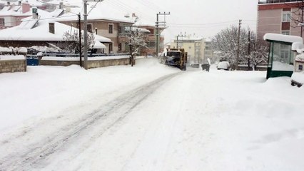 Uncle doing snow shoveling with giant conqueror truck