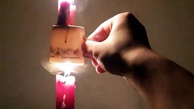 Extinguished Candle Skillfully Reignited in Slow Motion