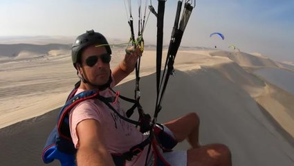 Paragliding Over The Scenic Dunes Of Qatar