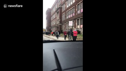 Despite COVID-19, voters wait in line to cast ballot in Wisconsin primary