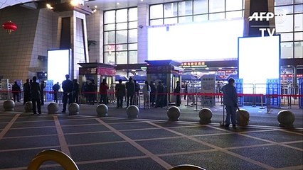Exodus begins as virus-hit Wuhan lifts ban on outbound travel