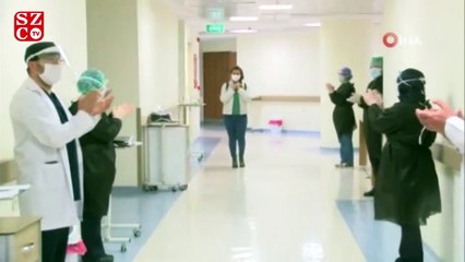 Taburcu olan sağlık çalışanı mahallesinde alkışlarla karşılandı