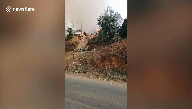 Panicked children run from raging forest fires in Laos