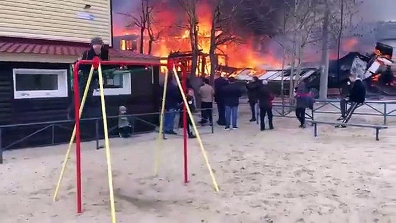 Boy Enjoys & Swings while house burns down