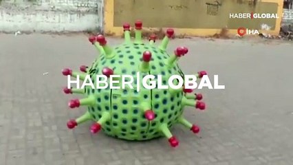 Otomobilini koronavirüse çevirdi, 'Evde Kal' çağrısı yaptı