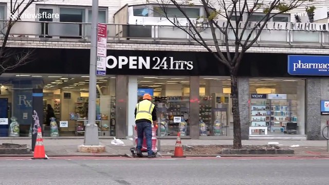 NYPD guard TOILET PAPER at New York City pharmacy as coronavirus panic buying