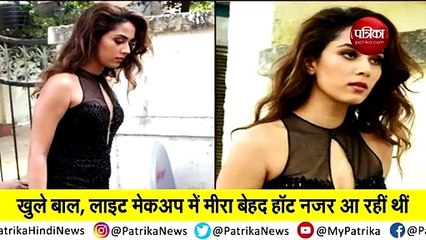 Meera's glamorous look in a black high slit gown