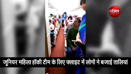 passengers applaud our champion womens hockey team in flight