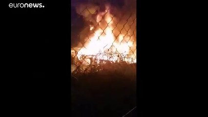Greek migrant camp is set alight as clashes shake Chios island