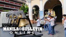 Church volunteers and priests of San Fernando de Dilao Parish conduct a motorcade procession