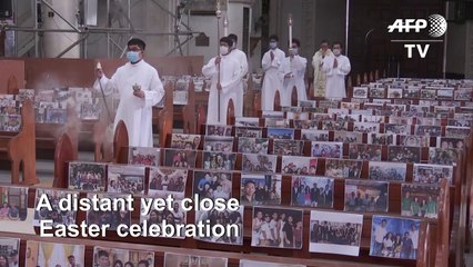 Family photos fill Philippines church pews for Easter