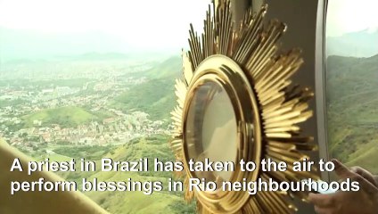 Catholic priest blesses Rio de Janeiro from the skies
