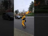 Guy Riding Unicycle and Playing Flaming Bagpipes Sprays Disinfectant in Portland Streets