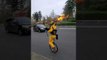 Guy Riding Unicycle and Playing Flaming Bagpipes Sprays Disinfectant in Portland Streets