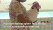 Newborns given tiny face shields at a Bangkok hospital