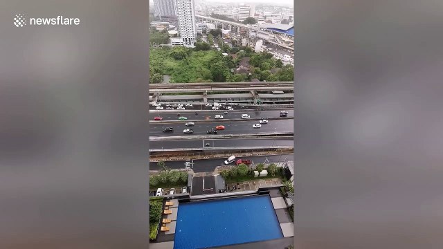 Dozens of vehicles skid and crash as rain causes slippy highway in Bangkok
