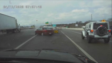 Cop nearly hit as car crashes on icy road