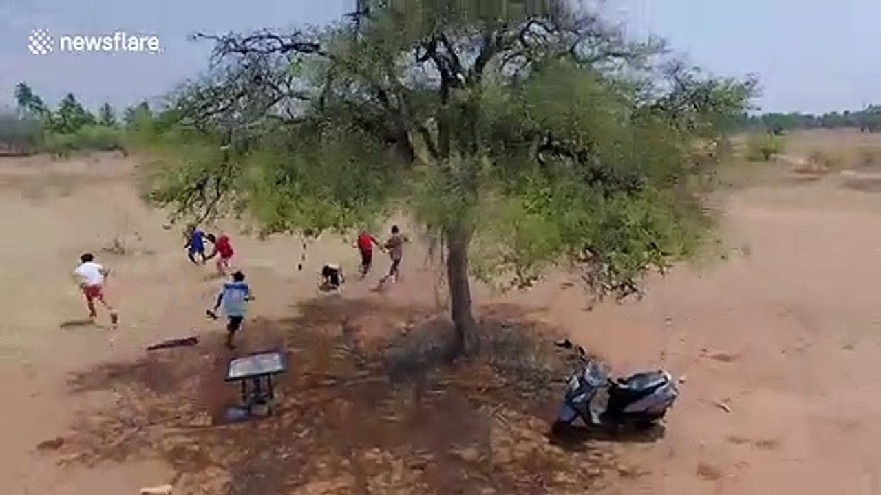 Groups of teens in India flee after being spotted by police drones during COVID-19 lockdown