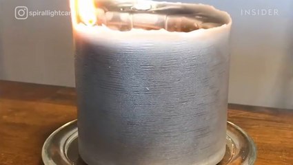 Candle with wick on the outside burns in a spiral