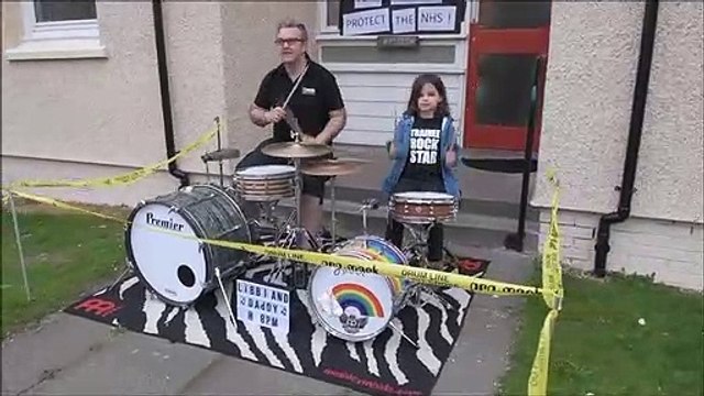 David Dowell of dD Drums and his daughter Libbi Dowell 6 playing the drums to spread the joy of noise for the NHS
