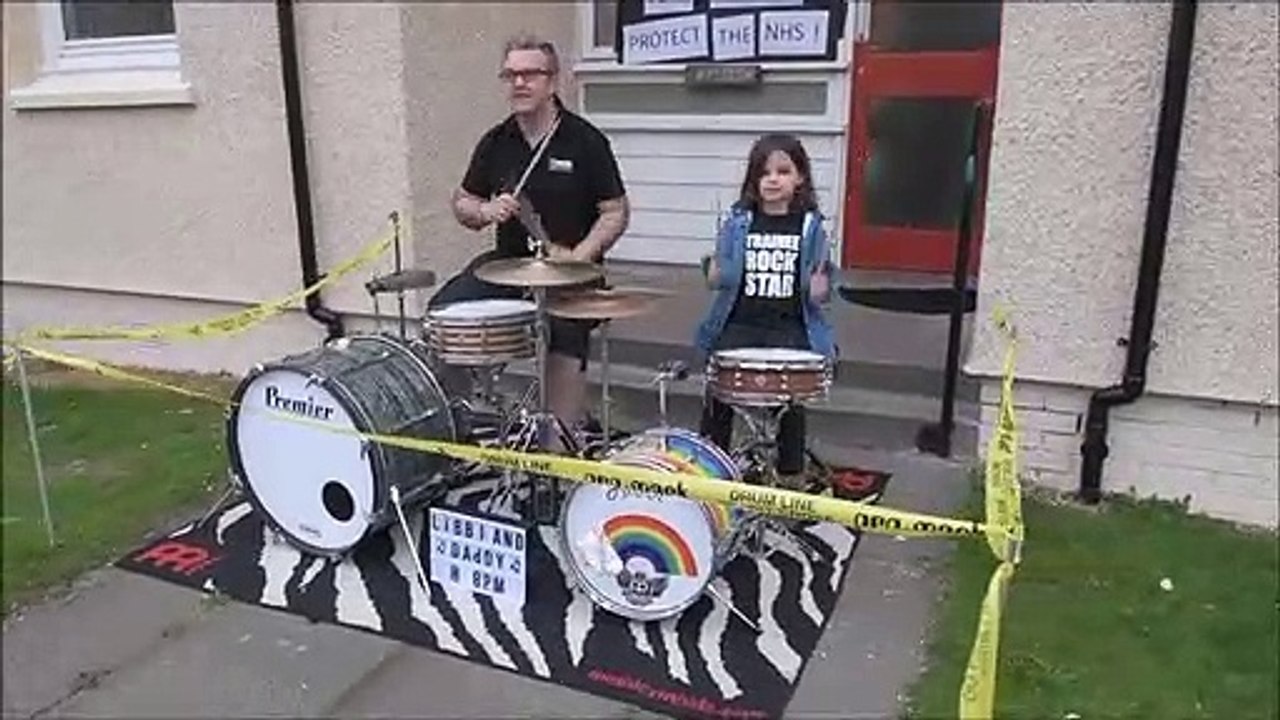 David Dowell of dD Drums and his daughter Libbi Dowell 6 playing the drums to spread the joy of noise for the NHS