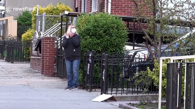 New Yorkers applaud health workers and first responders from home