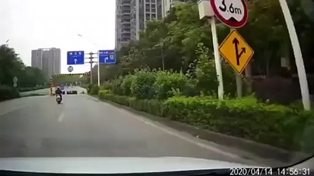 Woman pushing stroller in Chinese tunnel narrowly escapes being crushed by car