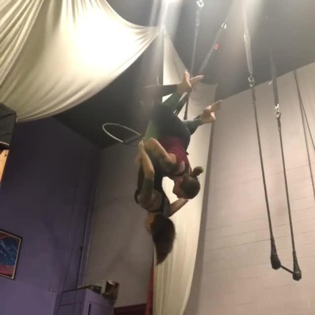 Girl's Pants Come Off While Trying Tricks on Trapeze With Friend