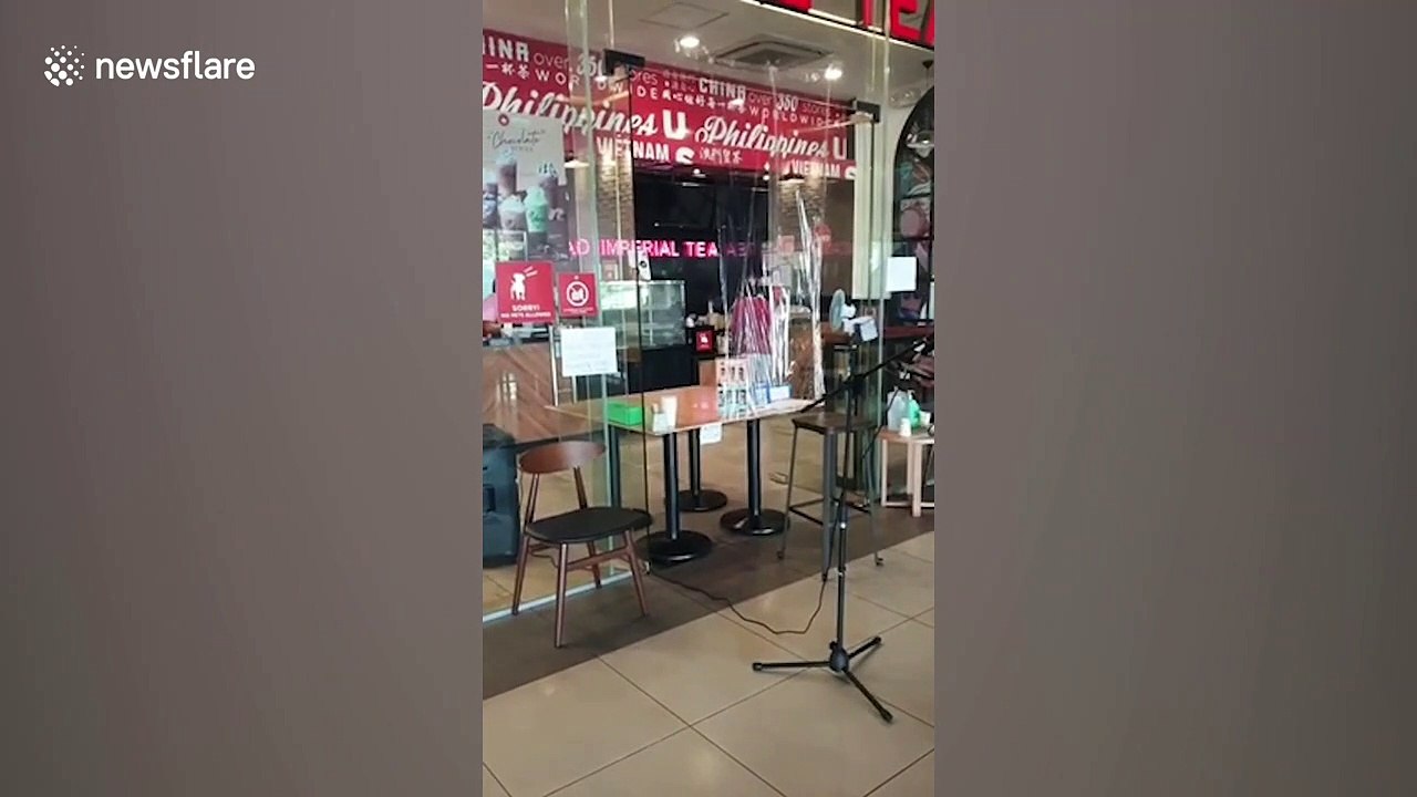 Filipino cafe sets up microphone for customers to keep safe distance amid COVID-19 pandemic