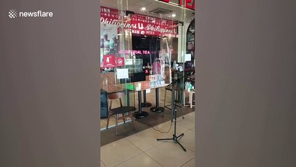 Filipino cafe sets up microphone for customers to keep safe distance amid COVID-19 pandemic
