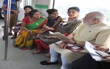 Selfies and smiles: PM Modi gets a rousing welcome at Delhi Metro