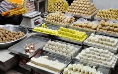 Confectionary serving sweets with party symbols in Howrah