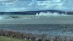 Spring storm sends large waves crashing into Lake Michigan