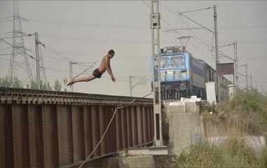 Watch: Youths perform stunt at rail bridge in UP's Deoria