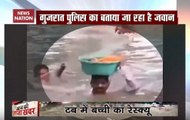 Vadodara: Cop carries toddler on his head, rescues her from flood