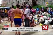 Iquitos: personas recogen alimentos de la basura