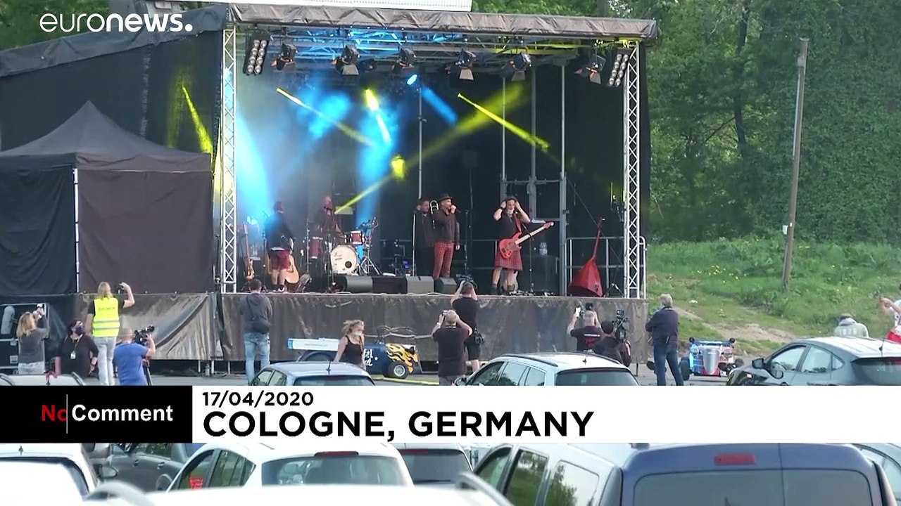 Let's party! People attend German concert drive-in cinema style