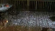 Back porch littered with hail during stormy night