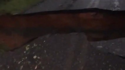 Road splinters under the force of the storm