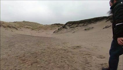 Breaking a coconut open with a small rock