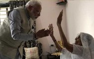 PM Narendra Modi meets his mother Heeraben before casting his vote