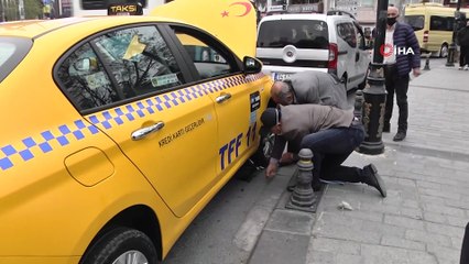 Gaziosmanpaşa'da taksinin altında sıkışan kediyi belediye ekipleri kurtardı