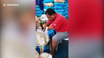 Disabled Filipino man helps pack food for neighbours during COVID-19 pandemic