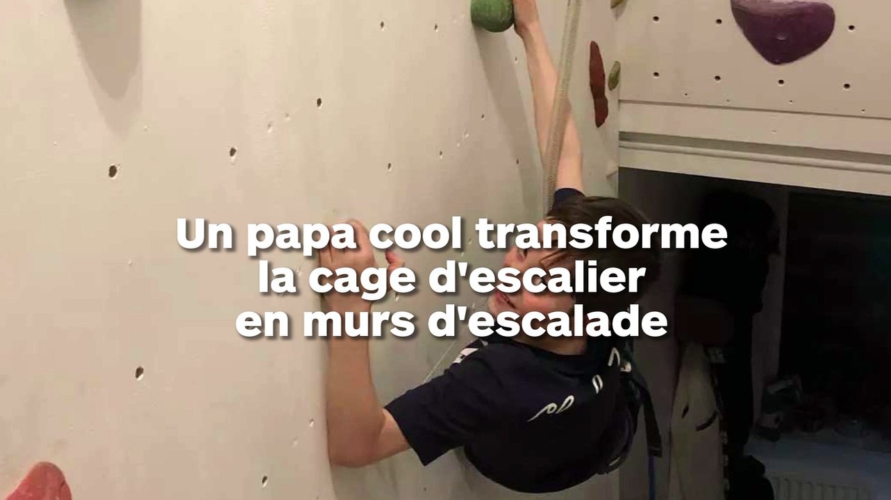 Un papa installe des murs d'escalade dans la cage d'escalier