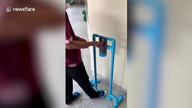 Thai worker creates device for people to press hand sanitiser bottle with feet during coronavirus pandemic