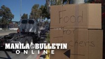 Los Angeles truck drivers union distributes food to truckers
