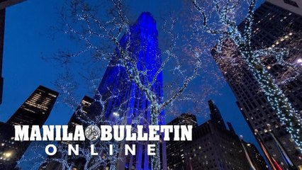 New York's Rockefeller Center glows blue in support of essential workers