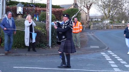 Andy Grant piping through South Charlton, near Alnwick, as part of Clap for the NHS