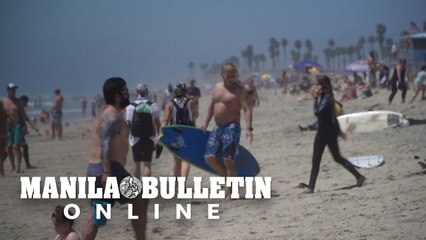 California crowds head to the beach despite virus stay-at-home order