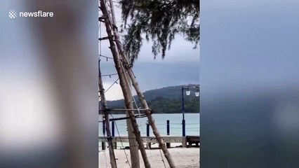 Beachgoers amazed as huge waterspout swirls near Cambodian island